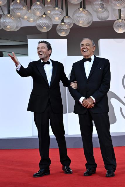President of Venice Film Festival Pietrangelo Buttafuocco (L) and Italian director of the Venice International Film Festival Alberto Barbera stand on the red carpet of the closing ceremony of the 83rd Venice Film Festival at Venice Lido on September 12, 2026 (Photo by Tiziana FABI / AFP)