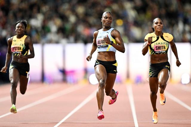 Jamaica's Brianna Lyston, Saint Lucia's Julien Alfred (C) and Jamaica's Jonielle Smith (R) compete in the women's 100m semi-final heat 2 during the World Athletics Ultimate Championship at the Gyula Zsivotzky National Athletics Centre, in Budapest on September 12, 2026. (Photo by Jewel SAMAD / AFP)