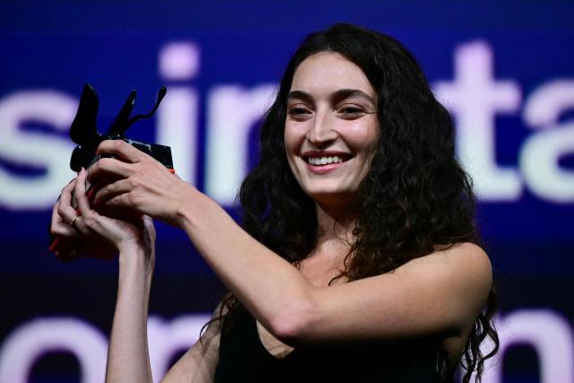 Shaden Safieddine Tazi receives the Orizzonti Award for Best Short film for "Quelques instants de bonheur" (A few moments of hapiness) during the closing ceremony of the 63rd Venice Film Festival at Venice Lido on September 12, 2026. (Photo by Stefano Rellandini / AFP)