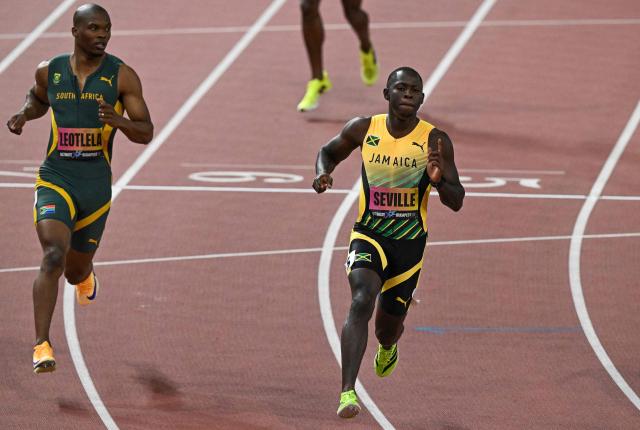 Jamaica's Oblique Seville (R) wins ahead of South Africa's athlete Gift Leotlela in the men's 100m semi-final during the World Athletics Ultimate Championship at the Gyula Zsivotzky National Athletics Centre, in Budapest on September 12, 2026. (Photo by Attila KISBENEDEK / AFP)