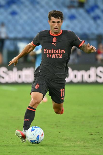 AC Milan's US forward #11 Christian Pulisic runs with the ball during the Italian Serie A football match between Lazio and AC Milan at the Olympic Stadium in Rome on September 12, 2026. (Photo by Alberto PIZZOLI / AFP)