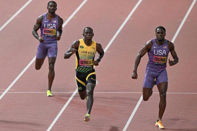 (From L) US' athlete Trayvon Bromell, Jamaica's Oblique Seville and US' Christian Coleman competes in the men's 100m semi-final during the World Athletics Ultimate Championship at the Gyula Zsivotzky National Athletics Centre, in Budapest on September 12, 2026. (Photo by Attila KISBENEDEK / AFP)