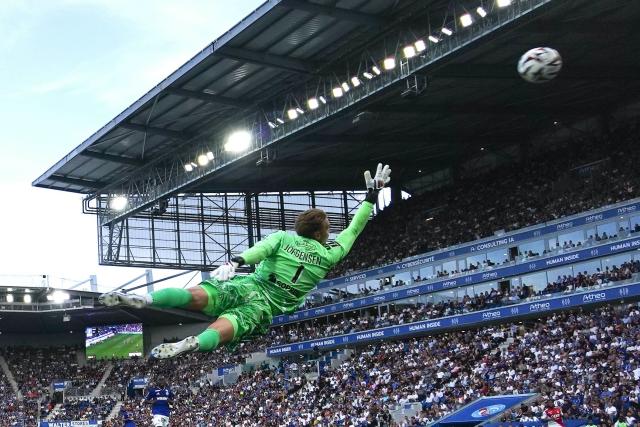Strasbourg’s Danish goalkeeper #01 Filip Jorgensen dives a concedes a goal by Monaco’s German forward #29 Paris Brunner during the French L1 football match between RC Strasbourg Alsace and AS Monaco at the Stade de la Meinau in Strasbourg, eastern France, on September 12, 2026. (Photo by SEBASTIEN BOZON / AFP)