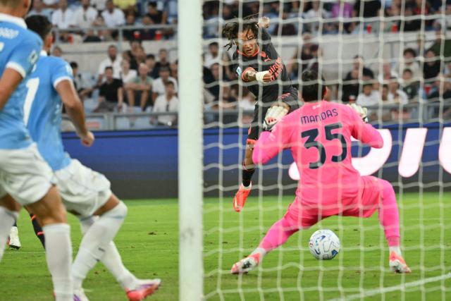 AC Milan's Belgian midfielder #22 Diego Moreira (C) shoots towards goal to score Milan's first goal during the Italian Serie A football match between Lazio and AC Milan at the Olympic Stadium in Rome on September 12, 2026. (Photo by Alberto PIZZOLI / AFP)