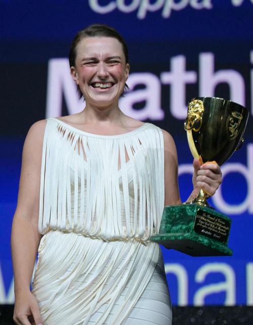 Danish actress Mathilde Arcel receives the Coppa Volpi for Best Actress she received for her part in "Woman Unknown" during the closing ceremony of the 63rd Venice Film Festival at Venice Lido on September 12, 2026. (Photo by Stefano Rellandini / AFP)