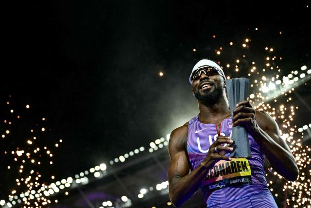 Winner US' Kenneth Bednarek celebrates with the trophy after his victory in the men's 100m final during the World Athletics Ultimate Championship at the Gyula Zsivotzky National Athletics Centre, in Budapest on September 12, 2026. (Photo by Ben STANSALL / AFP)