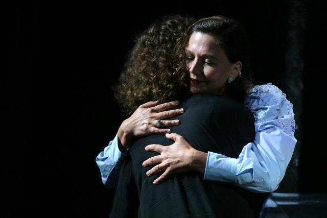 Danish director May El-Toukhy is congratulated by the president of the jury Maggie Gyllenhall as she receives the Golden Lion for Best Film for "Kvinde Ukendt" (Woman unknown) during the closing ceremony of the 63rd Venice Film Festival at Venice Lido on September 12, 2026. (Photo by Stefano Rellandini / AFP)