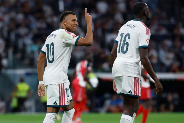 Real Madrid's French forward #10 Kylian Mbappe celebrates scoring the opening goal during the Spanish league football match between Real Madrid CF and Rayo Vallecano de Madrid at Santiago Bernabeu Stadium in Madrid on September 12, 2026. (Photo by Oscar DEL POZO / AFP)