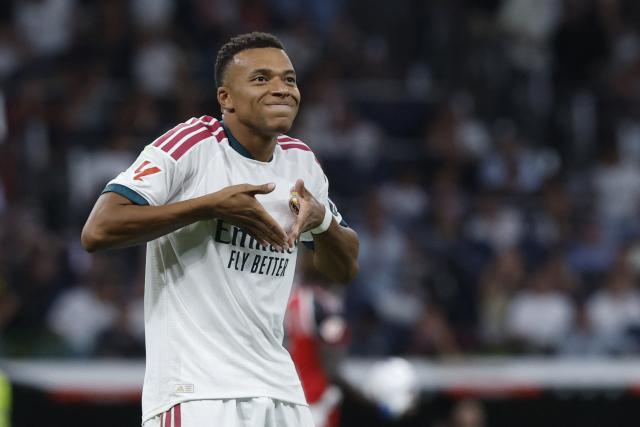 Real Madrid's French forward #10 Kylian Mbappe celebrates scoring the opening goal during the Spanish league football match between Real Madrid CF and Rayo Vallecano de Madrid at Santiago Bernabeu Stadium in Madrid on September 12, 2026. (Photo by Oscar DEL POZO / AFP)