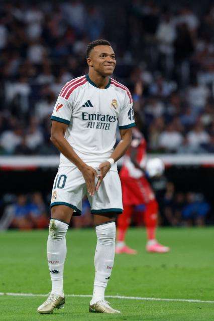 Real Madrid's French forward #10 Kylian Mbappe celebrates scoring the opening goal during the Spanish league football match between Real Madrid CF and Rayo Vallecano de Madrid at Santiago Bernabeu Stadium in Madrid on September 12, 2026. (Photo by Oscar DEL POZO / AFP)