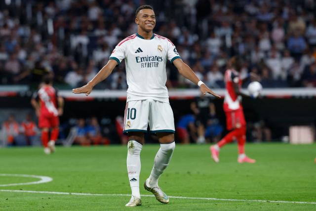 Real Madrid's French forward #10 Kylian Mbappe celebrates scoring the opening goal during the Spanish league football match between Real Madrid CF and Rayo Vallecano de Madrid at Santiago Bernabeu Stadium in Madrid on September 12, 2026. (Photo by Oscar DEL POZO / AFP)