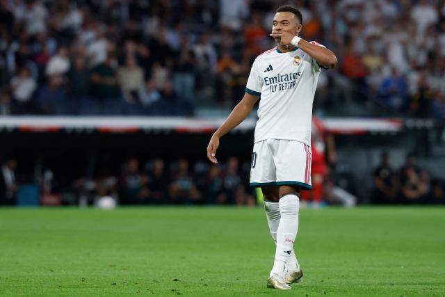 Real Madrid's French forward #10 Kylian Mbappe celebrates scoring the opening goal during the Spanish league football match between Real Madrid CF and Rayo Vallecano de Madrid at Santiago Bernabeu Stadium in Madrid on September 12, 2026. (Photo by Oscar DEL POZO / AFP)