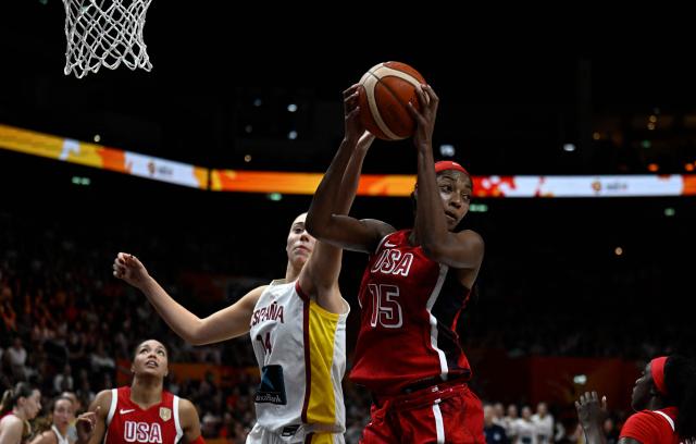 Spain's power forward #14 Raquel Carrera and USA's forward #15 Angel Reese vie for the ball during the 2026 FIBA Women's Basketball World Cup semi-final match between Spain and the United States in Berlin on September 12, 2026. (Photo by Tobias SCHWARZ / AFP)