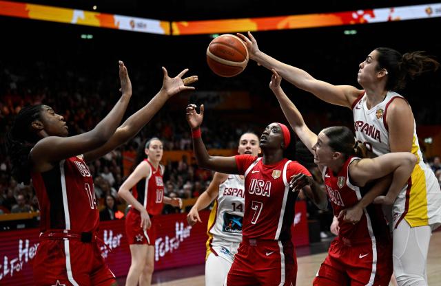Players vie for the ball during the 2026 FIBA Women's Basketball World Cup semi-final match between Spain and the United States in Berlin on September 12, 2026. (Photo by Tobias SCHWARZ / AFP)