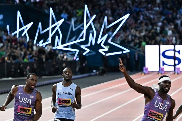 (L-R) US' Ronnie Baker and Botswana's Letsile Tebogo react as US' Kenneth Bednarek wins the men's 100m final during the World Athletics Ultimate Championship at the Gyula Zsivotzky National Athletics Centre, in Budapest on September 12, 2026. (Photo by Jewel SAMAD / AFP)