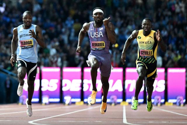 US' Kenneth Bednarek (C) wins ahead of Jamaica's Oblique Seville (R) and Botswana's Letsile Tebogo in the men's 100m final during the World Athletics Ultimate Championship at the Gyula Zsivotzky National Athletics Centre, in Budapest on September 12, 2026. (Photo by Jewel SAMAD / AFP)