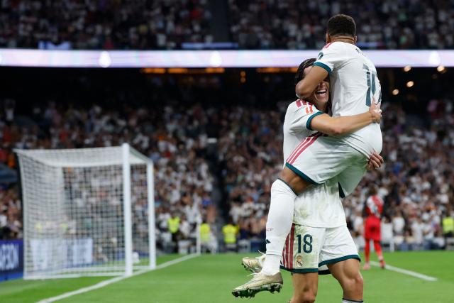 Real Madrid's Spanish defender #18 Alvaro Fernandez Carreras  (L) celebrates with Real Madrid's French forward #10 Kylian Mbappe after scoring his team's second goal during the Spanish league football match between Real Madrid CF and Rayo Vallecano de Madrid at Santiago Bernabeu Stadium in Madrid on September 12, 2026. (Photo by Oscar DEL POZO / AFP)