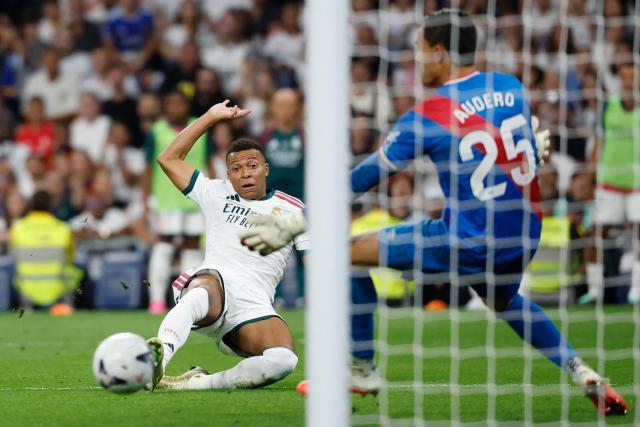 Real Madrid's French forward #10 Kylian Mbappe attempts to score during the Spanish league football match between Real Madrid CF and Rayo Vallecano de Madrid at Santiago Bernabeu Stadium in Madrid on September 12, 2026. (Photo by Oscar DEL POZO / AFP)
