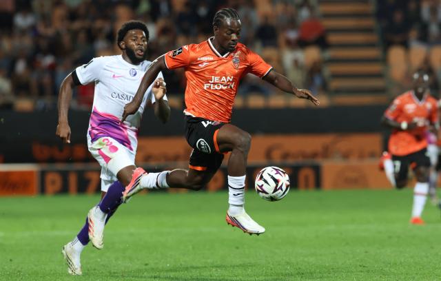 Lorient's French forward #42 Mamadou Kone fights for the ball with Toulouse's American defender #03 Mark McKenzie during the French L1 football match between FC Lorient and Toulouse FC at the Stade du Moustoir in Lorient, western France, on September 12, 2026. (Photo by Fred TANNEAU / AFP)