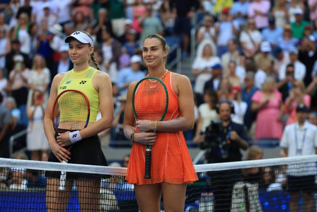 Kazakhstan's Elena Rybakina and Belarus's Aryna Sabalenka stand on the court before the women's singles final tennis match on day fourteen of the US Open tennis tournament at the USTA Billie Jean King National Tennis Center in New York City on September 12, 2026. (Photo by TIMOTHY A. CLARY / AFP)