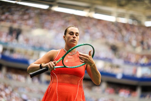Belarus's Aryna Sabalenka checks her racquet during the women's singles final tennis match against Kazakhstan's Elena Rybakina on day fourteen of the US Open tennis tournament at the USTA Billie Jean King National Tennis Center in New York City on September 12, 2026. (Photo by CHARLY TRIBALLEAU / AFP)