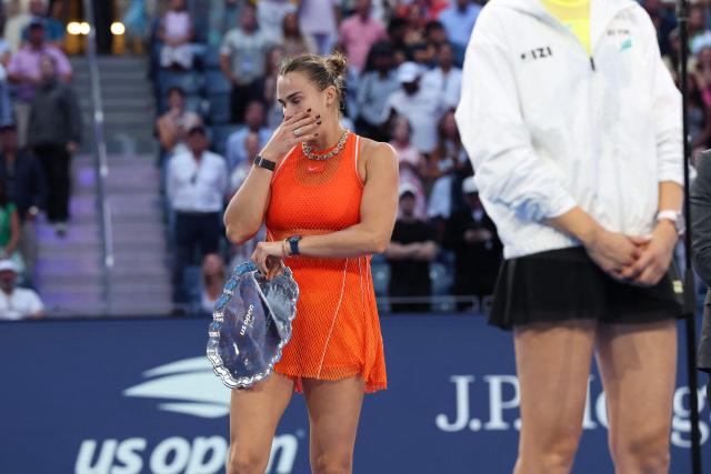 Belarus's Aryna Sabalenka reacts while holding the runner-up trophy after the women's singles final tennis match against Kazakhstan's Elena Rybakina on day fourteen of the US Open tennis tournament at the USTA Billie Jean King National Tennis Center in New York City on September 12, 2026. (Photo by TIMOTHY A. CLARY / AFP)