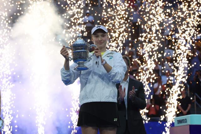 Kazakhstan's Elena Rybakina holds the winner's trophy after winning the women's singles final tennis match against Belarus's Aryna Sabalenka on day fourteen of the US Open tennis tournament at the USTA Billie Jean King National Tennis Center in New York City on September 12, 2026. (Photo by TIMOTHY A. CLARY / AFP)