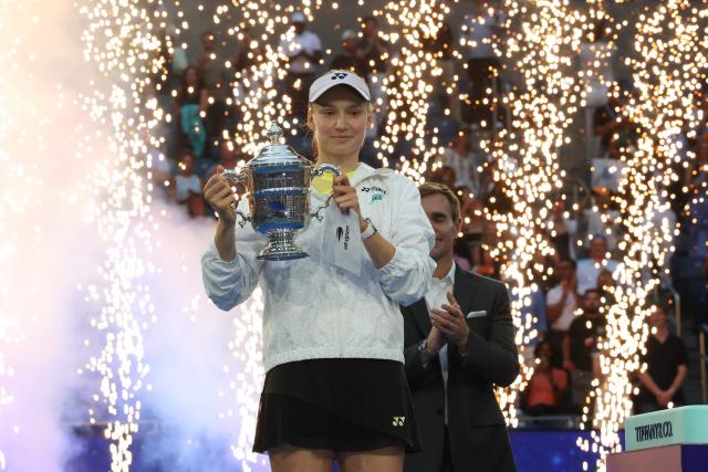 Kazakhstan's Elena Rybakina holds the winner's trophy after winning the women's singles final tennis match against Belarus's Aryna Sabalenka on day fourteen of the US Open tennis tournament at the USTA Billie Jean King National Tennis Center in New York City on September 12, 2026. (Photo by TIMOTHY A. CLARY / AFP)