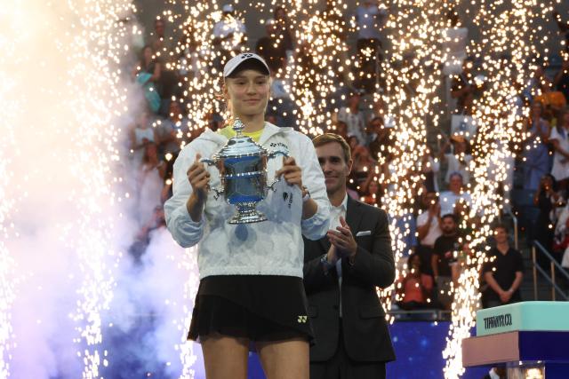Kazakhstan's Elena Rybakina holds the winner's trophy after winning the women's singles final tennis match against Belarus's Aryna Sabalenka on day fourteen of the US Open tennis tournament at the USTA Billie Jean King National Tennis Center in New York City on September 12, 2026. (Photo by TIMOTHY A. CLARY / AFP)