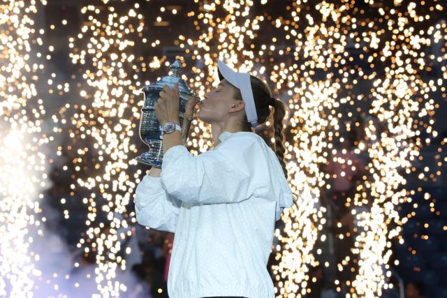 Kazakhstan's Elena Rybakina kisses the winner's trophy after winning the women's singles final tennis match against Belarus's Aryna Sabalenka on day fourteen of the US Open tennis tournament at the USTA Billie Jean King National Tennis Center in New York City on September 12, 2026. (Photo by TIMOTHY A. CLARY / AFP)