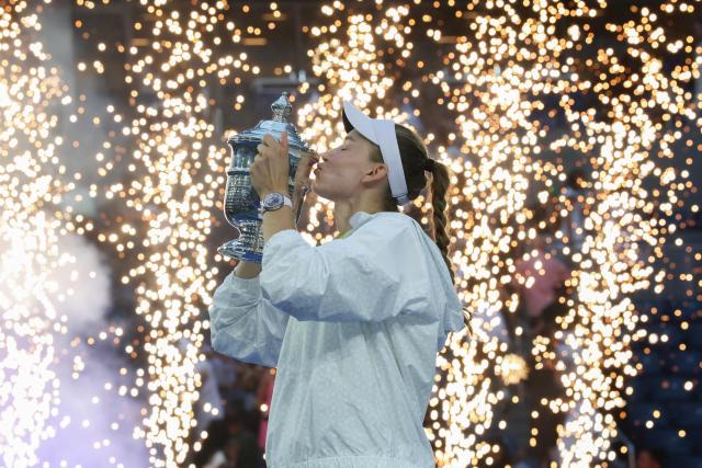 Kazakhstan's Elena Rybakina kisses the winner's trophy after winning the women's singles final tennis match against Belarus's Aryna Sabalenka on day fourteen of the US Open tennis tournament at the USTA Billie Jean King National Tennis Center in New York City on September 12, 2026. (Photo by TIMOTHY A. CLARY / AFP)