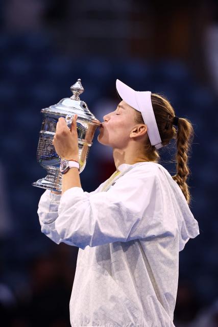Kazakhstan's Elena Rybakina kisses the winner's trophy after winning the women's singles final tennis match against Belarus's Aryna Sabalenka on day fourteen of the US Open tennis tournament at the USTA Billie Jean King National Tennis Center in New York City on September 12, 2026. (Photo by CHARLY TRIBALLEAU / AFP)