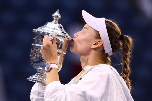Kazakhstan's Elena Rybakina kisses the winner's trophy after winning the women's singles final tennis match against Belarus's Aryna Sabalenka on day fourteen of the US Open tennis tournament at the USTA Billie Jean King National Tennis Center in New York City on September 12, 2026. (Photo by CHARLY TRIBALLEAU / AFP)
