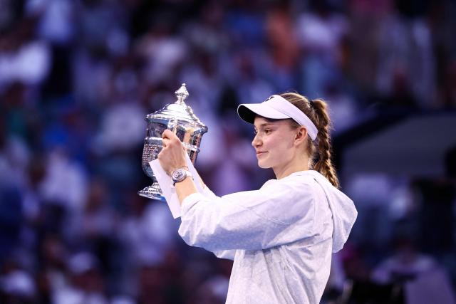 Kazakhstan's Elena Rybakina holds up the winner's trophy after winning the women's singles final tennis match against Belarus's Aryna Sabalenka on day fourteen of the US Open tennis tournament at the USTA Billie Jean King National Tennis Center in New York City on September 12, 2026. (Photo by CHARLY TRIBALLEAU / AFP)