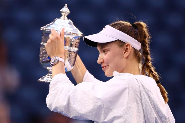 Kazakhstan's Elena Rybakina holds up the winner's trophy after winning the women's singles final tennis match against Belarus's Aryna Sabalenka on day fourteen of the US Open tennis tournament at the USTA Billie Jean King National Tennis Center in New York City on September 12, 2026. (Photo by CHARLY TRIBALLEAU / AFP)