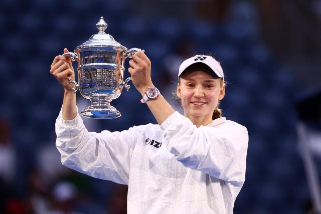 Kazakhstan's Elena Rybakina holds up the winner's trophy after winning the women's singles final tennis match against Belarus's Aryna Sabalenka on day fourteen of the US Open tennis tournament at the USTA Billie Jean King National Tennis Center in New York City on September 12, 2026. (Photo by CHARLY TRIBALLEAU / AFP)