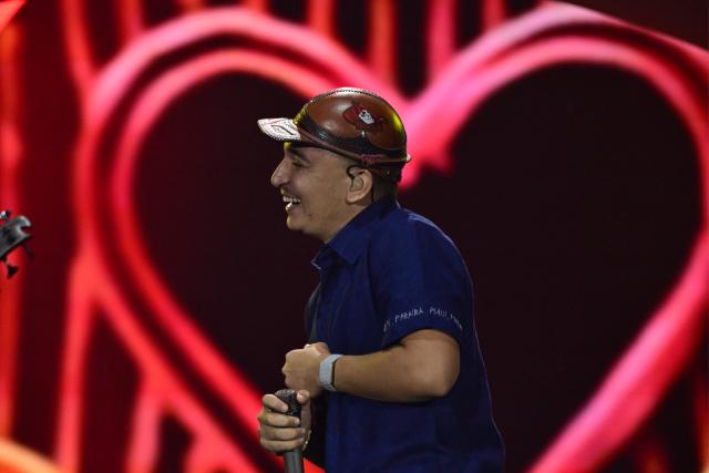 Brazilian singer Joao Gomes performs during the Rock in Rio music festival at Rio 2016 Olimpyc Park in Rio de Janeiro, Brazil September 12, 2026. (Photo by Pablo PORCIUNCULA / AFP)