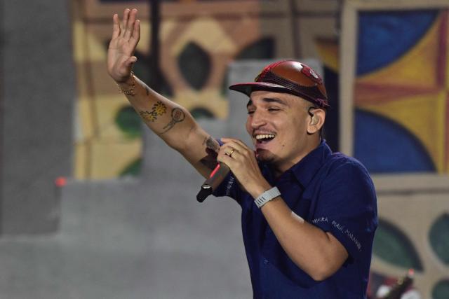 Brazilian singer Joao Gomes performs during the Rock in Rio music festival at Rio 2016 Olimpyc Park in Rio de Janeiro, Brazil September 12, 2026. (Photo by Pablo PORCIUNCULA / AFP)