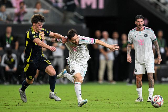 Inter Miami's Argentine forward #10 Lionel Messi fights for the ball with Nashville's US midfielder #16 Matthew Corcoran (L) during a Major League Soccer (MLS) regular season football match between Inter Miami CF and Nashville FC at Nu Stadium in Miami, Florida, on September 12, 2026. (Photo by CHANDAN KHANNA / AFP)