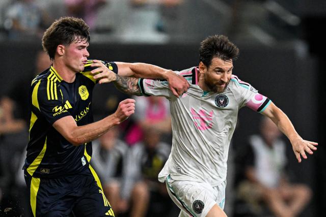 Inter Miami's Argentine forward #10 Lionel Messi fights for the ball with Nashville's US midfielder #16 Matthew Corcoran (L) during a Major League Soccer (MLS) regular season football match between Inter Miami CF and Nashville FC at Nu Stadium in Miami, Florida, on September 12, 2026. (Photo by CHANDAN KHANNA / AFP)