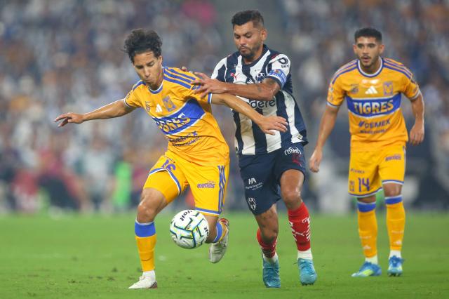 Tigres' midfielder #16 Diego Lainez and Monterrey's forward #17 Jesus Corona fight for the ball during the Liga MX Apertura tournament football match between Monterrey and Tigres, at the BBVA Stadium in Guadalupe, state of Nuevo Leon, Mexico, on September 12, 2026. (Photo by Julio Cesar AGUILAR / AFP)