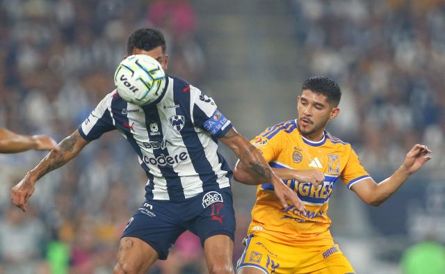 Monterrey's Argentine midfielder #07 Lucas Ocampos and Tigres' midfielder #16 Diego Lainez fight for the ball during the Liga MX Apertura tournament football match between Monterrey and Tigres, at the BBVA Stadium in Guadalupe, state of Nuevo Leon, Mexico, on September 12, 2026. (Photo by Julio Cesar AGUILAR / AFP)