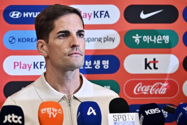 South Korea National Football Team’s interim coach Robert Moreno of Spain speaks to the media at Incheon International Airport on September 13, 2026. (Photo by Lillian SUWANRUMPHA / AFP)