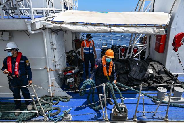 Body bags containing victims of a ferry that caught fire are seen (centre R) on board a coast guard ship in Coron, Palawan on September 13, 2026. The death toll from a Philippine ferry fire jumped to 76 on September 12 after the coast guard confirmed the discovery of 41 more bodies aboard the burnt-out vessel. (Photo by Jam STA ROSA / AFP)