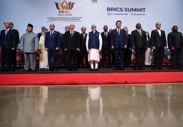 In this pool photograph distributed by the Russian state agency Sputnik, leaders of participating countries gather for a family photo during the 18th BRICS Summit in New Delhi on September 13, 2026. (Photo by Alexander KAZAKOV / POOL / AFP) / ***Editor's note : this image is distributed by the Russian state owned agency Sputnik***