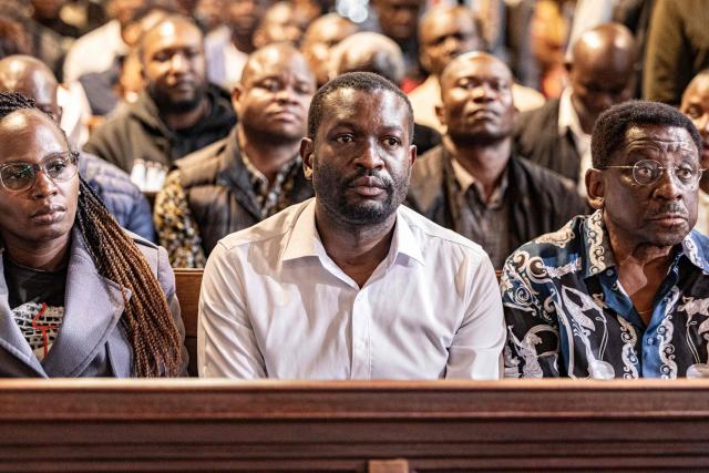 Nairobi Senator Edwin Sifuna (middle) attends a church service at the All Saints Cathedral,  ahead of the Linda Mwananchi (protect citizens) political rally in Nairobi on September 13, 2026. A heavy police presence was deployed in Nairobi for a rally by a rising opposition star on Sunday, following a wave of political violence in recent weeks.
Edwin Sifuna has emerged as the biggest threat to President William Ruto ahead of the latter's bid for re-election in August 2027.
Sifuna, 44, has built momentum by tapping into widespread anger over corruption and political violence, though others argue he is too young and inexperienced for the top office.
His rally began with a church visit in central Nairobi early Sunday, with hundreds of rowdy supporters already gathered outside and a large number of police officers maintaining a perimeter, AFP journalists saw. (Photo by SIMON MAINA / AFP)