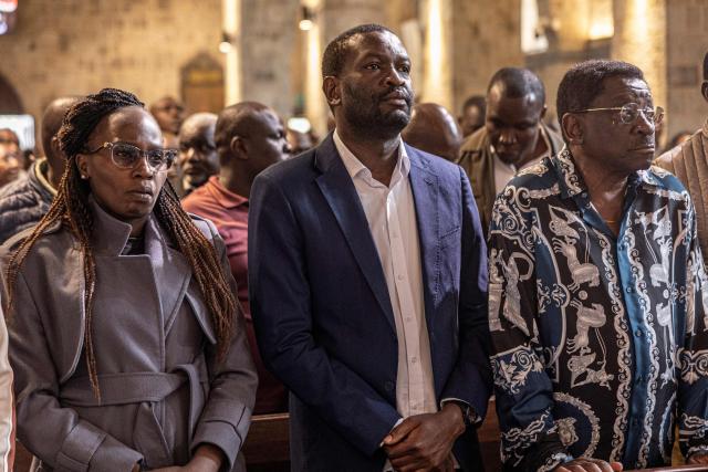 Nairobi Senator Edwin Sifuna (C) attends a church service at the All Saints Cathedral,  ahead of the Linda Mwananchi (protect citizens) political rally in Nairobi on September 13, 2026. A heavy police presence was deployed in Nairobi for a rally by a rising opposition star on Sunday, following a wave of political violence in recent weeks.
Edwin Sifuna has emerged as the biggest threat to President William Ruto ahead of the latter's bid for re-election in August 2027.
Sifuna, 44, has built momentum by tapping into widespread anger over corruption and political violence, though others argue he is too young and inexperienced for the top office.
His rally began with a church visit in central Nairobi early Sunday, with hundreds of rowdy supporters already gathered outside and a large number of police officers maintaining a perimeter, AFP journalists saw. (Photo by SIMON MAINA / AFP)