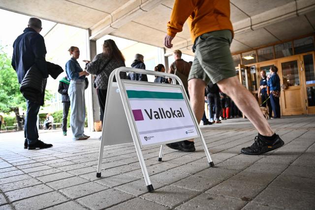 People queue to vote for Sweden's general election at a polling station in Stockholm, Sweden, on September 13, 2026. Polling stations opened in Sweden in what is expected to be a close general election that will see either the far right enter government for the first time or the left-wing opposition reclaim power. (Photo by Martin PAHLMBLAD / TT NEWS AGENCY / AFP) / Sweden OUT