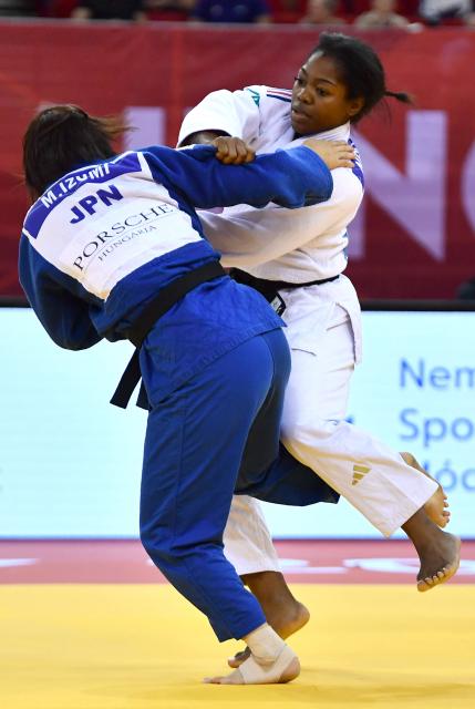 France’s Liz Ngelebeya (R, white) and Japan’s Mao Izumi compete in the women's under 78kg category bout at the Hungary Grand Slam judo tournament, part of the IJF World Judo Tour, in Budapest on September 13, 2026. (Photo by FERENC ISZA / AFP)