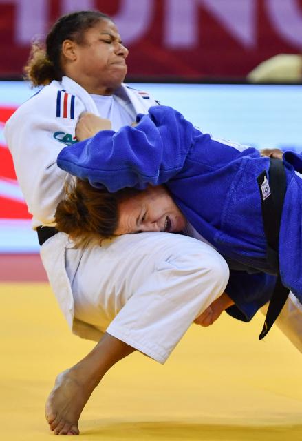 France’s Fanny Estelle Posvite (L, white) and Germany’s Lea Schmid compete in the women's under 78kg category bout at the Hungary Grand Slam judo tournament, part of the IJF World Judo Tour, in Budapest on September 13, 2026. (Photo by FERENC ISZA / AFP)